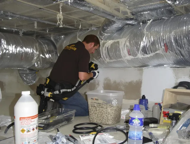 Clinton Air Duct Cleaning specialist performing professional mold removal from air ducts in Clinton