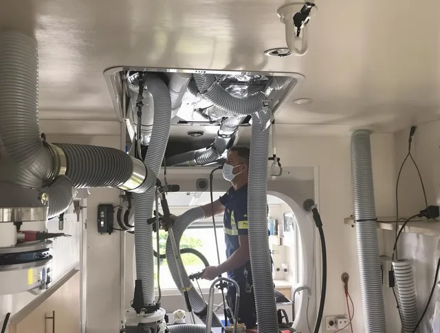 Clinton Air Duct Cleaning specialist performing precise mobile home duct cleaning in Clinton
