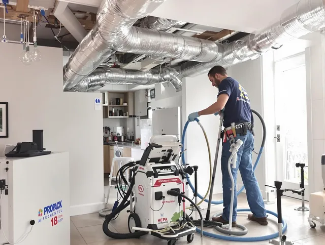 Clinton Air Duct Cleaning technician performing advanced pure duct cleaning with specialized equipment in Clinton