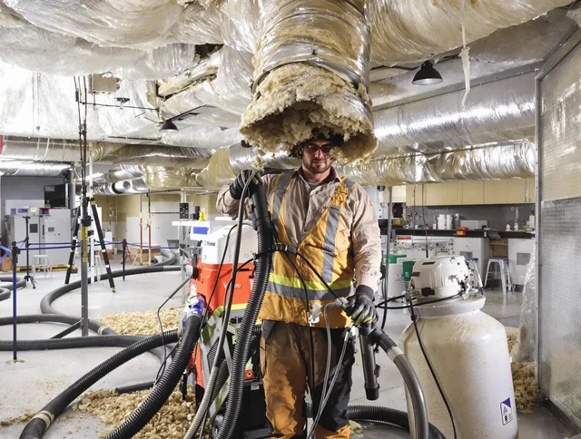 Professional vacuum insulation removal by Clinton Air Duct Cleaning expert in Clinton